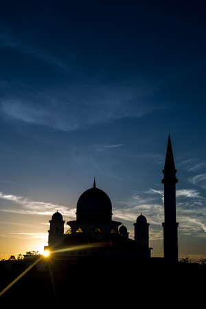 silhouette of a mosque during sunsetの写真素材
