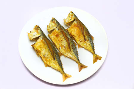 Fried mackarel on a plateの写真素材