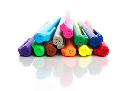 colourful pen on white reflective surfaceの写真素材