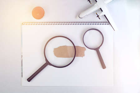 magnifying glass on note book, seaching conceptの写真素材