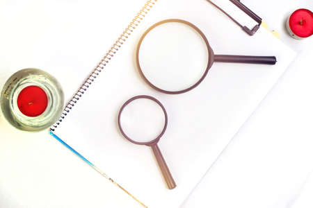 magnifying glass on note bookの写真素材