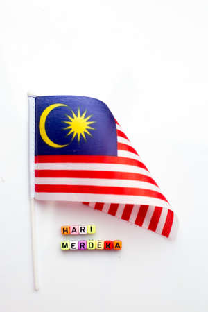 Malaysian flag with dice test wrote "hari merdeka"の写真素材