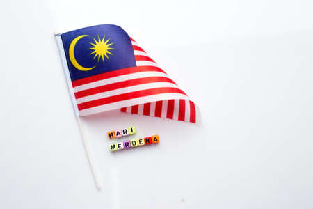 Malaysian flag with dice test wrote "hari merdeka"の写真素材