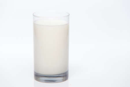 Glass of milk on white backgroundの写真素材