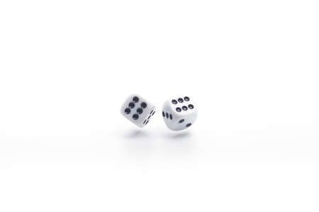 Dice on white isolated background, selective focusの写真素材