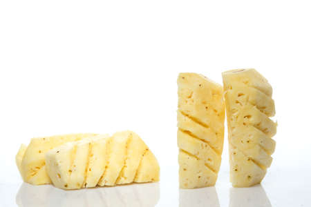 cut pineapple on white isolated backgroundの写真素材