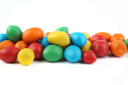 colorful chocolate coated peanut on white isolated backgroundの写真素材