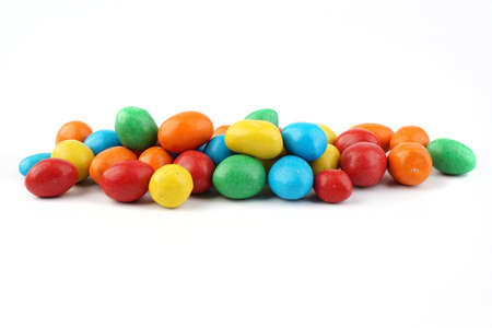 colorful chocolate coated peanut on white isolated backgroundの写真素材