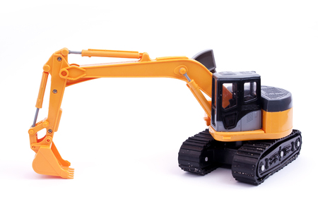 Toy tracked excavator with grab loweredの写真素材