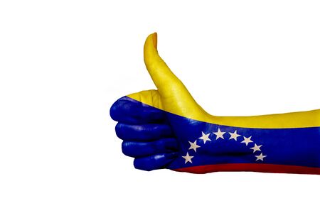 Venezuela flag painted on hand showing thumbs upの写真素材