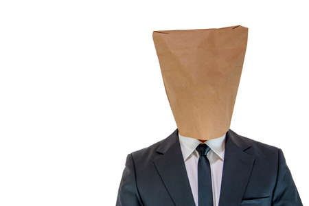 Man wearing a paper bag on his head out of embarrassmentの写真素材
