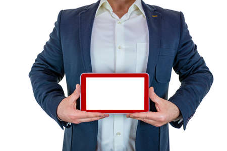 Man in suit is holding red tablet with both handsの写真素材
