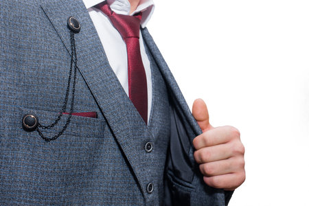 Men's stylish gray trendy suit with white shirt and red tie.の写真素材