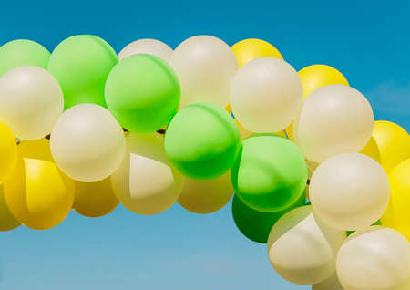 Colorful bright balloons against the blue sky close-up.の写真素材