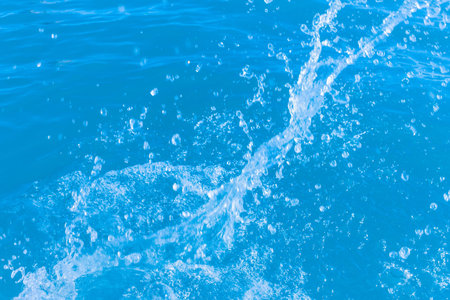 Splashes of fresh clean blue seawater close-up background.