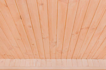 Modern natural interior with light wood ceiling texture background.の写真素材