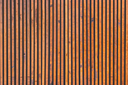 Brown wooden vertical lines modern interior plank surface texture background.