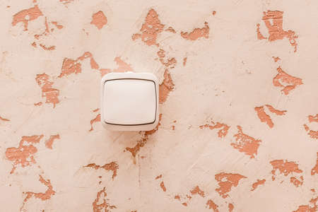 Electric switch on the wall in a modern room interior background.の写真素材