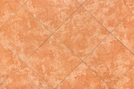 Orange or brown ceramic floor tiles with abstract texture background pattern, top view.の写真素材
