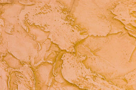 Orange-brown wall texture with abstract background pattern.の写真素材