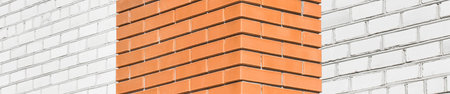 Part of the architectural element of the brown and white bricks of the facade of the building...
