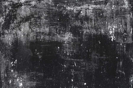 Old scratched grunge black painted metal surface texture background.の写真素材