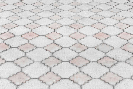 Gray paving slabs urban floor with geometric pattern texture city background.の写真素材