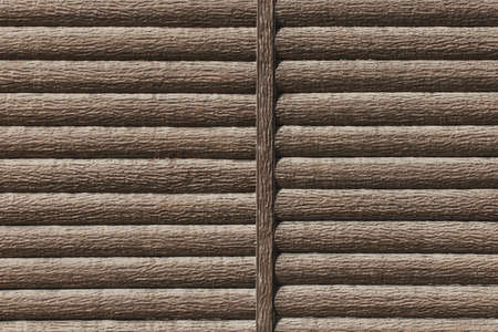 Decorative wooden wall or fence brown color modern interior logs texture background.の写真素材