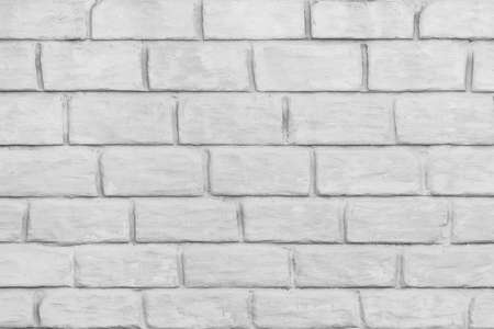 Light gray or white brick block wall surface texture background.の写真素材