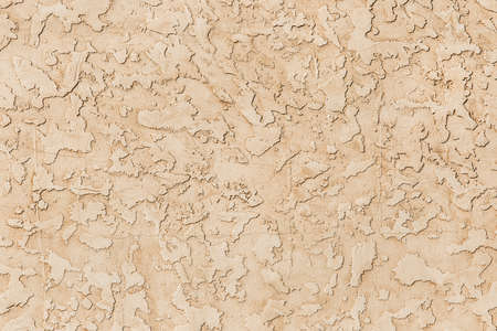 Light beige decorative plaster abstract wall texture stucco pattern background.の写真素材