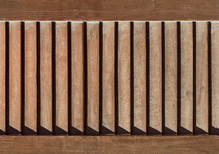 Part of modern interior with brown horizontal pattern texture of wooden shutters, casements or blinds background.の写真素材
