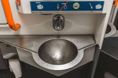 Sink of automatic water supply in a modern toilet of the Stadler train.の写真素材