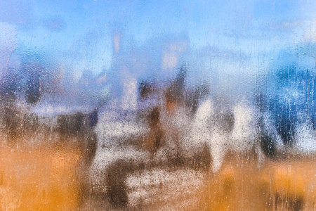 Water-emulsion or oil paint with an abstract color pattern on a dark dirty metal texture,...