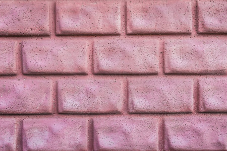 Decorative abstract brick wall texture, red blocks, background, closeup wallpaper, front view.