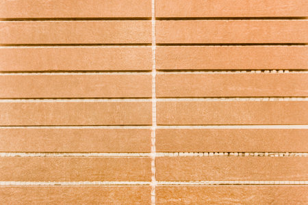Abstract brown tile texture, pattern of thin long tiles background.