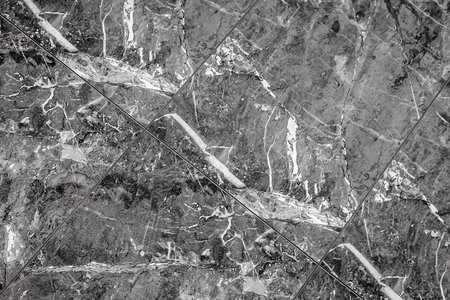 Texture of dark gray decorative ceramic tiles with abstract white pattern black background.の写真素材