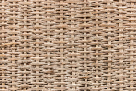 Beige wicker basket texture background, abstract symmetric seamless brown pattern, handmade.の写真素材