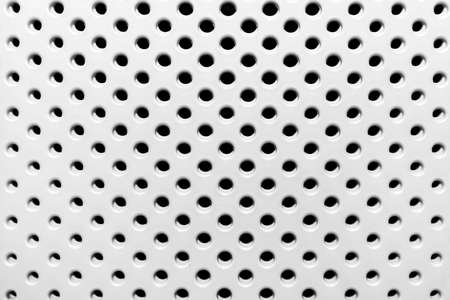 Seamless texture of a white plastic basket with abstract circle patterns round background.の写真素材