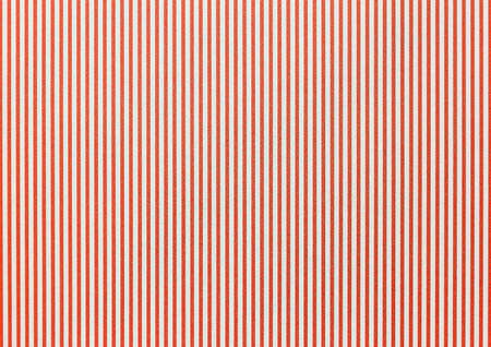 Texture of light red abstract wallpaper with a pattern of vertical lines, background.の写真素材