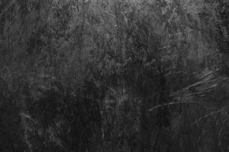 Black and white old dirty grunge surface scratched dark metal texture background.の写真素材