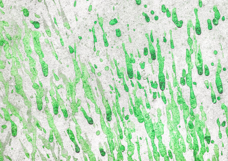 Green paint splashes and drops on old dirty white concrete light wall texture background.
