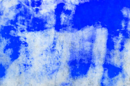 Blue paint spots and pattern on a old light marble abstract wall texture background.の写真素材