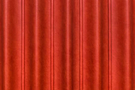 Sliding door, red curtain scene from the leather of the conference room in the hotel. Wavy abstract pattern wall texture background.の写真素材