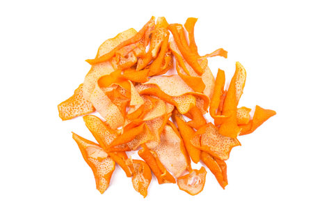 A pile of dried orange peels isolated on a white background.の写真素材