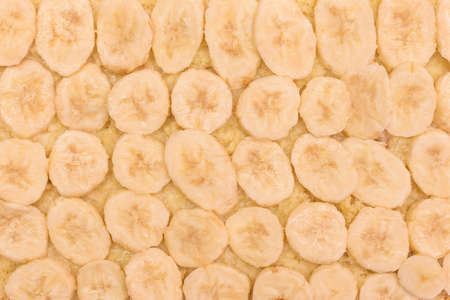 Sliced pieces banana on pastry pie design food background.の写真素材