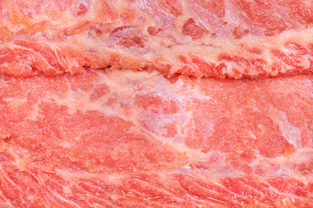 Raw red meat ambassador, pork neck background, close-up.