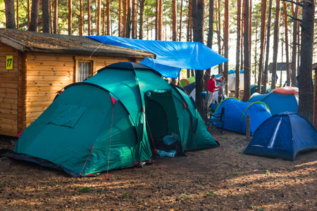 Belarus, Minsk region - June 29, 2019: Camp in the forest outdoor, travel and vacation in tents lifestyle, camping.のeditorial素材