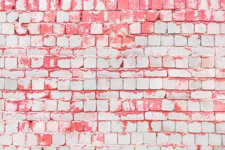 Old white brick wall with pink paint on surface texture background.の写真素材