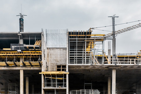 Unfinished new concrete architecture modern urban building at a construction site.