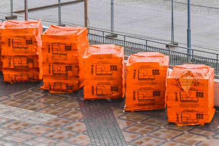 Belarus, Minsk - March 14, 2020: Brick blocks packed industrial materials at a construction site.のeditorial素材